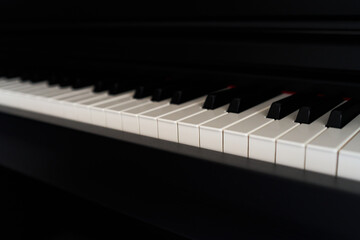 Fototapeta premium Close up of piano keyboard. Selective focus and shallow depth of field.
