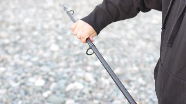 Fishing Preparation Sequence &ndash; Close-Up of Hands Hooking Worm on Line Before Casting