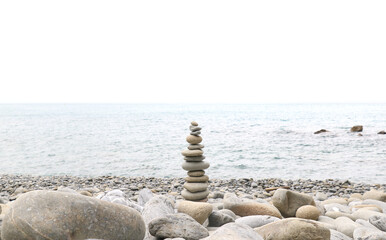 Balanced stones stacked on the beach with calm sea background, symbolizing harmony, balance, and mindfulness in nature. Perfect concept for wellness, meditation, and tranquility themes.