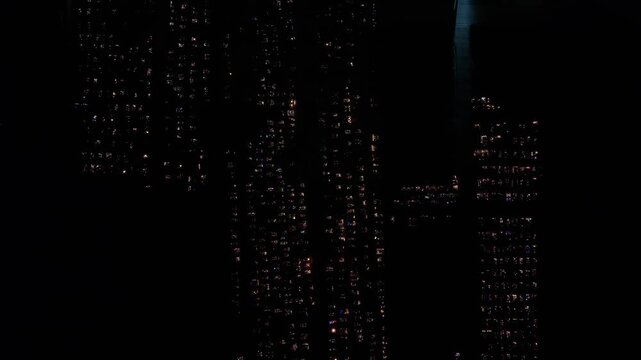 Aerial view of a Polish cemetery on All Saints&rsquo; Night, glowing with thousands of candles that honor the dead and illuminate the darkness with warmth and faith.