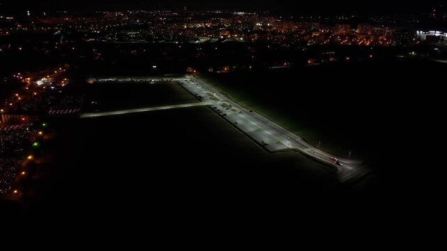 Aerial view of a Polish cemetery on All Saints&rsquo; Night, glowing with thousands of candles that honor the dead and illuminate the darkness with warmth and faith.