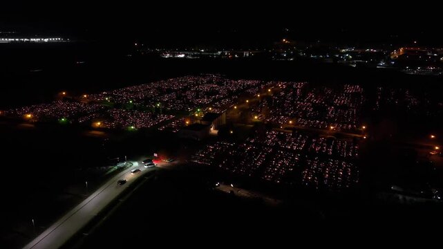 Aerial view of a Polish cemetery on All Saints&rsquo; Night, glowing with thousands of candles that honor the dead and illuminate the darkness with warmth and faith.