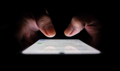 Night, cybersecurity and hands typing with phone for texting, internet troll or person...