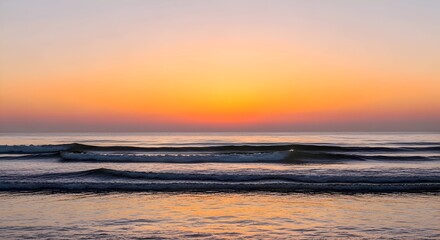 Obraz premium Ocean Waves at Sunset - A Serene Coastal Scene.