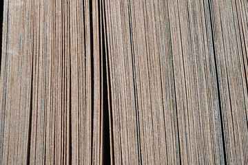 Close-up of the surface of a book spine,The image shows a close-up of a cream-colored book's edge, with neatly stacked pages and a smooth surface. The red binding contrasts beautifully with the pale.