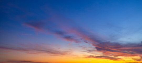 Clouds and sky backdrop at sunrise and sunset,Sunrise background. Dramatic majestic scenery sunset. Sky with clouds in Sunrise sky light background. Sunrise with clouds in various shapes.