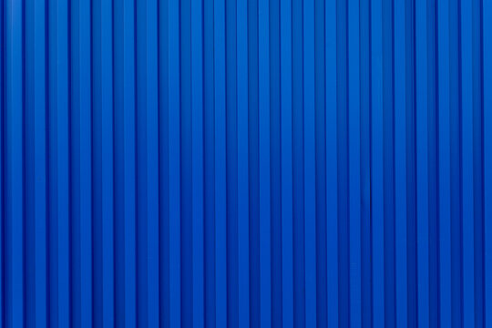 Blue building wall zinc backdrop,Blue shipping container wall. Seamless vertical metal panel texture with embossed ridges and industrial design. Cargo container backdrop. Realistic vector illustration