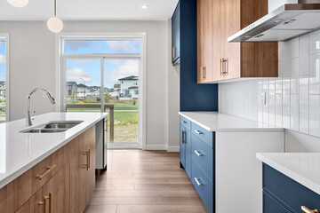 Kitchen with a white counter and blue cabinets