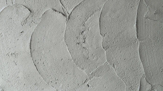 Rough cement texture wet Plaster wall Background, Concrete mortar mix sand material construction house site stucco raw loft wall decorative polished pattern design well free space for text