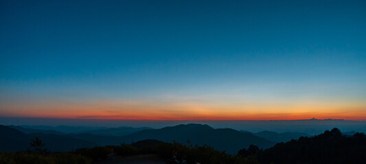 sunset sky on top of mountain and valleys. Natural landscape