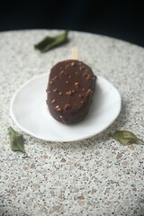 Tasty ice-cream on a white plate