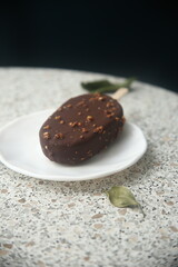 chocolate ice cream on a white plate