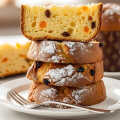Slices of panettone stacked on a plate.