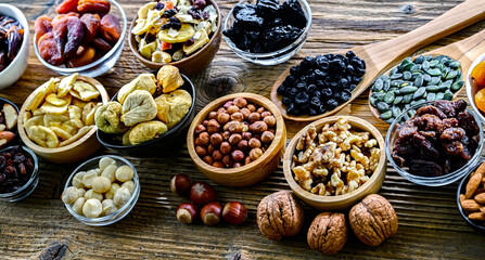 Fototapeta premium Composition with a variety of dried fruits and assorted nuts.