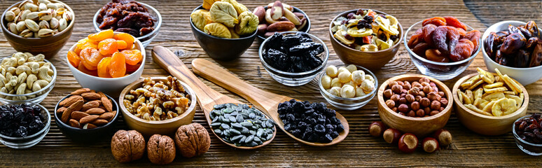 Composition with a variety of dried fruits and assorted nuts.