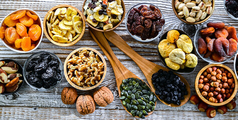 Composition with a variety of dried fruits and assorted nuts.