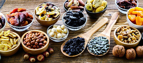 Composition with a variety of dried fruits and assorted nuts.