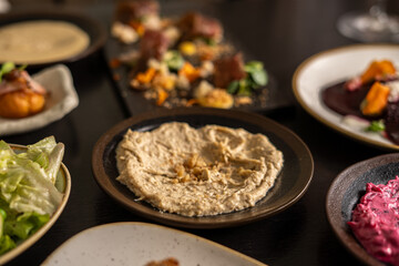 Delicious gourmet dishes served on a dark wooden table