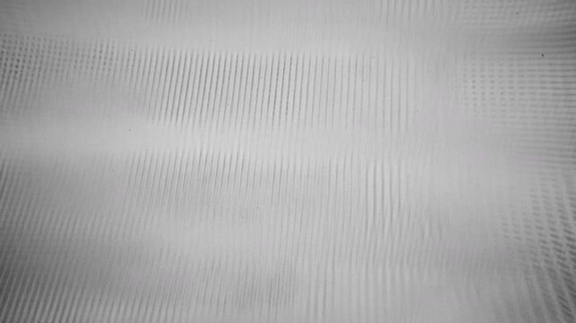 analog VHS video noise texture with horizontal lines and flickering distortion. The image shows a vintage television screen effect with static, interference, and scanlines.