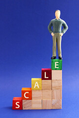 Staircase made of wooden blocks, executive reaches the top level