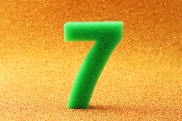 Lucky number seven on a prosperous gold background