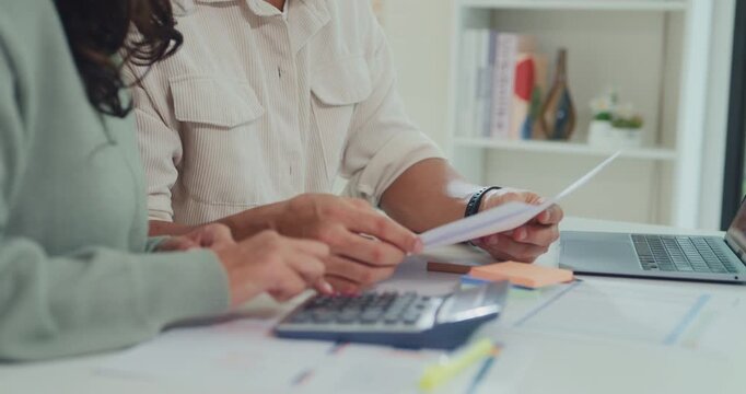 Close up young Latin couple male, female serious focus on laptop computer check document paper pay bills online plan budget expense in living room at home. Marriage money trouble, Family budget plan.