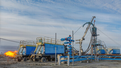 The Northern gas field. Summer. Installation for lowering a flexible pipe into a well. Equipment for testing and development of a gas well
