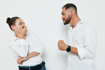 Professional man in a smart shirt engages on an isolated colored backdrop, showing strong emotion...