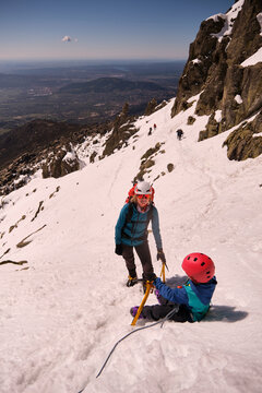 Family hiking through the snowy mountains