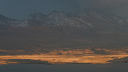 Golden Hour Glow on a Vast Mountain Landscape