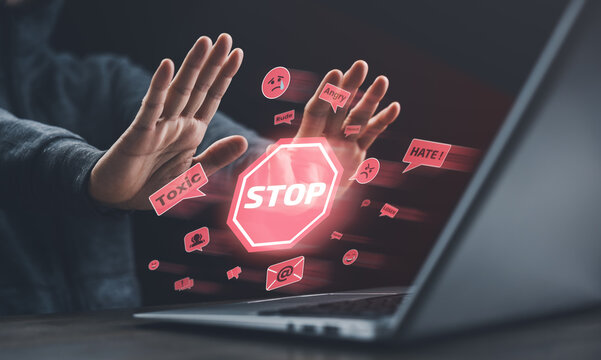 A man raises hands to stop toxic and hateful online messages, representing cyberbullying prevention, internet safety, and digital awareness against social media abuse.
