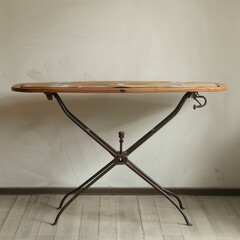 Elegant Bistro Table: An antique, weathered bistro table, its wrought iron frame providing a charming contrast to the worn wooden tabletop, exudes a sense of history and quiet elegance. 