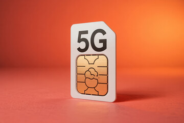 White 5G SIM card with metallic chip on an orange background for high speed mobile network connection