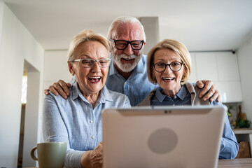 Senior friends having video call conversation on tablet