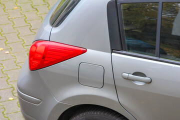 Red heart-shaped sticker on rear window of gray car parked in Antalya, Turkey. High quality photograph