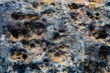 stone texture, Weathered Volcanic Rock Texture with Pitted Surface and Iron Oxide Colors