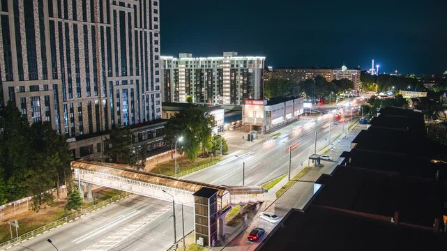 Night city, time-lapse of moving cars on the streets of the night city in Anapa