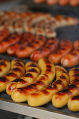 Grilling sausages on the grill with flames and smoke. food tasty sausadges, Sausage grilled to perfection on Barbeque.