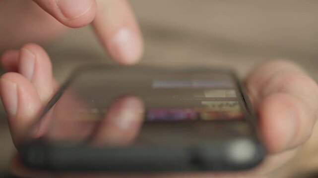 An indepth and detailed view showcasing hands actively interacting with a smartphone screen, emphasizing the significance of modern technology and the prevalent usage of mobile applications today