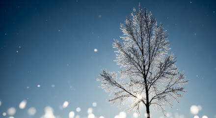 Solitary Winter Tree Against Clear Blue Sky with Falling Snow

