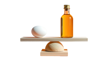 A balanced composition with a white egg and amber liquid-filled bottle, supported by light wood against black background