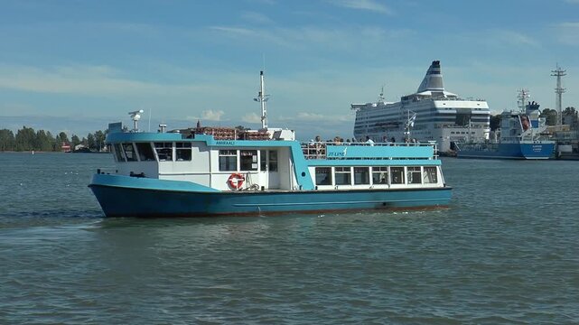 HELSINKI, FINLAND - July 13, 2016: A small boat AMIRAALI on Silja Line ship background bright summer day.