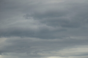 Calm blue sky with clouds of different shapes, background image