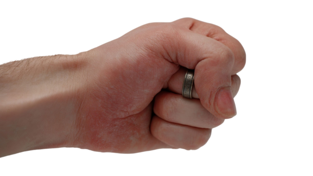 PNG of A close-up of a clenched fist holding a ring, symbolizing strength and commitment.