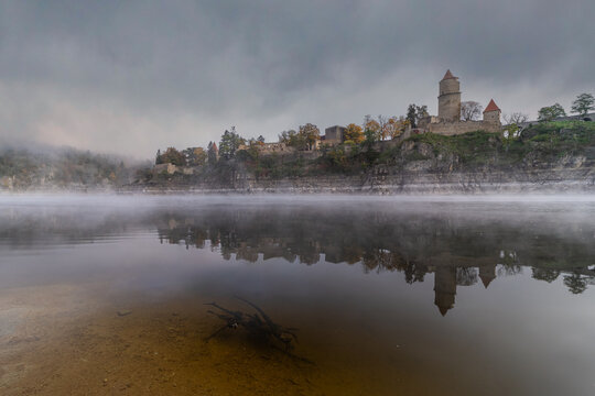 Zvikov castle in morning fog, medieval gothic castle standing on a rock above the confluence of the Vltava and Otava rivers, South Bohemian Region, Czechia, Czech republic