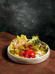 Assorted snacks from fermented cabbage, cucumbers and tomatoes, green bean. Decorated cranberry. Fermented healthy food concept. Pickled cucumbers, marinated tomatoes Vertical.