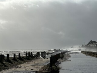 Huge waves crashing a stone pier during a storm at Southampton, England, UK.