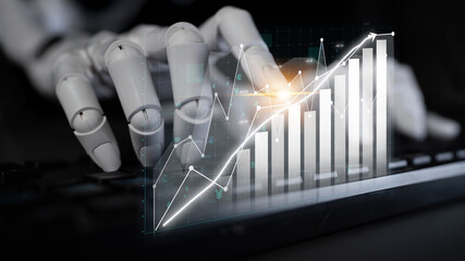 A robotic hand engages with visual financial data on a keyboard, showcasing the intersection of...