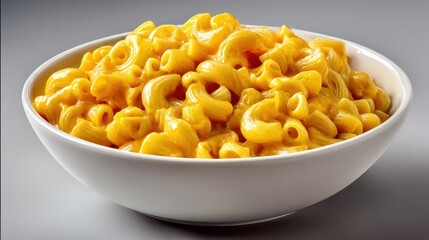 Comforting bowl of creamy macaroni and cheese with elbow pasta and melted cheddar sauce