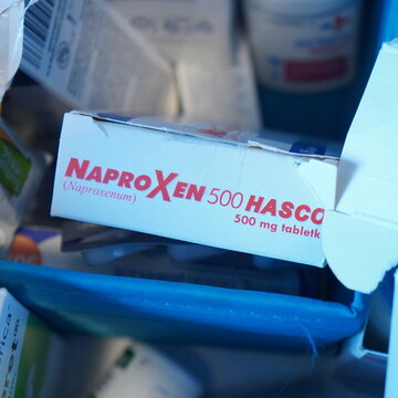 Naproxen 500 HASCO box of medication, a common non-steroidal anti-inflammatory drug (NSAID), seen among other pharmaceutical products, highlighting essential medical supplies